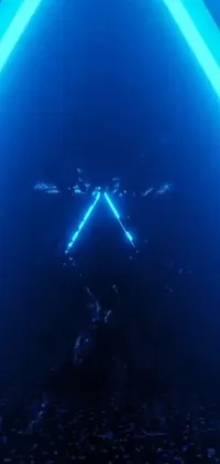Experience a mesmerizing live wallpaper for your phone featuring a neon triangle glowing in a dark room
