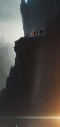 This live wallpaper features a mesmerizing group of individuals standing atop a serene mountain vista