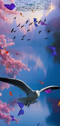 This scenic live wallpaper for phones showcases a flock of birds flying over a calm body of water
