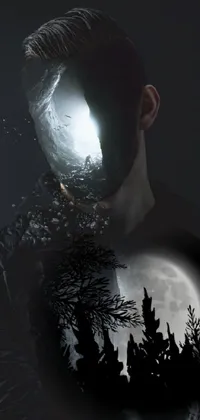 This phone live wallpaper showcases a dark and atmospheric digital art design featuring a silhouette of a man standing in front of a glowing full moon