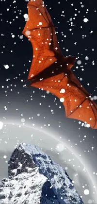 This stunning live wallpaper boasts a surreal scene of a red kite soaring above a snow-covered mountain landscape