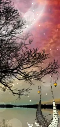 This mobile live wallpaper features a beautiful purple flower with a swing on a tree nearby