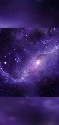 Experience the stunning beauty of a purple galaxy with stars in the background through this phone live wallpaper