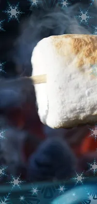 Looking to add some fun to your phone wallpaper? This lively 4K live wallpaper features a close-up of roasting marshmallows on a stick, set against a colorful ice cream-inspired backdrop