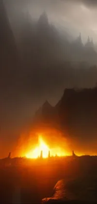 This phone live wallpaper depicts a lush green hillside with iron smelting pits and flaming fires