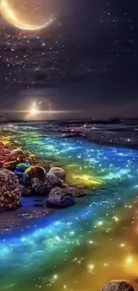 This phone live wallpaper features a stunning scene of a river running through a sandy beach under a full moon