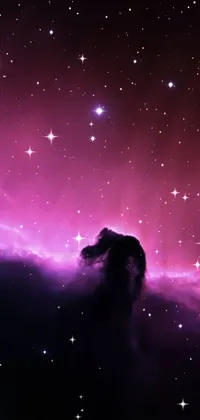 This live wallpaper presents a captivating purple nebula with numerous twinkling stars as the backdrop