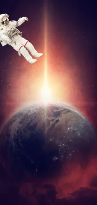 This stunning live wallpaper features a mesmerising astronaut floating in outer space above Earth, with the planet visible in the background