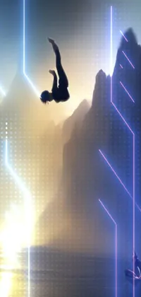 Get ready to add some adventure to your phone background with this stunning live wallpaper! You'll be treated to an incredible image of a person flying through the air over a body of water, doing a backflip in a brilliantly stylized silhouette