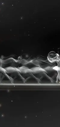 This live phone wallpaper displays a stunning black and white image of a ballerina in motion