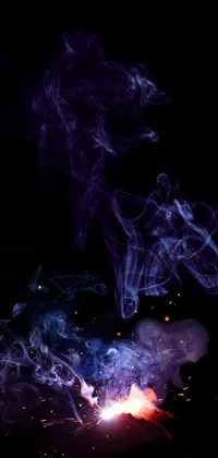 This phone live wallpaper showcases a vivid and striking image of a crackling fire with swirling smoke, designed in digital art style with a blue and purple color scheme