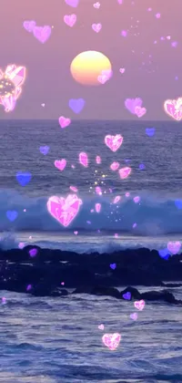 This phone live wallpaper features a group of floating hearts in pink and red hues over a calm body of water