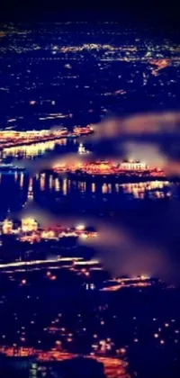 This live wallpaper showcases a stunning aerial view of a city at night