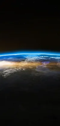 This live phone wallpaper displays a stunning view of the Earth from space, complete with a digital rendering of the planet's curvature, as well as picturesque sunset and sunrise scenes