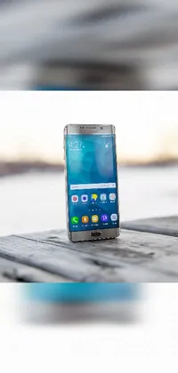 This phone live wallpaper shows a close-up view of an Android Samsung Galaxy device with a February wallpaper displaying a beautiful image