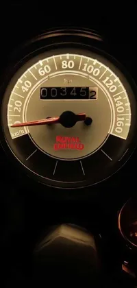 This phone live wallpaper showcases a hyperrealistic close up of a speedometer on a rugged and adventurous Mahindra Thar motorcycle