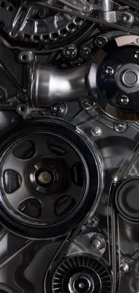 This stunning phone live wallpaper boasts a close-up view of a car engine, showcasing the intricate details of its mechanical components in beautiful UHD quality