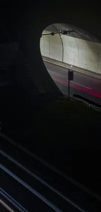 This live wallpaper for phones features a night scene showing a train journey through a tunnel