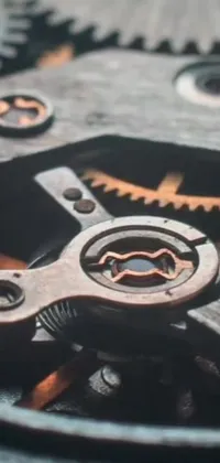 Get mesmerized with this stunning live wallpaper of a watch's intricate gears made of metal and wood