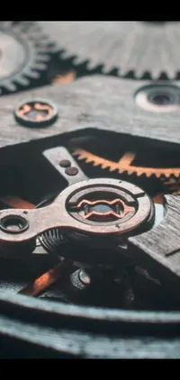 This phone live wallpaper showcases a digital rendering of watch gears in stunning detail