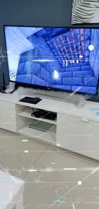 This phone live wallpaper features a sleek entertainment center with a flat screen TV on top