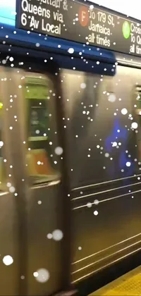 This phone live wallpaper features a serene scene of a subway train arriving at a snow-covered station in Chicago