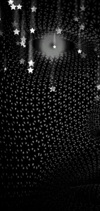 This mesmerizing phone live wallpaper features a black and white image of a light at the end of a tunnel with a hex mesh pattern that creates a mysterious and minimalist vibe