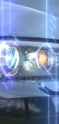 If you're a fan of cars, you'll love this stunning phone live wallpaper! It boasts a close-up of a car's headlight, rendered digitally with an impressive holographic effect that makes it really pop off the screen