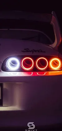 This trendy live wallpaper showcases a close up of car tail lights, complete with a white light halo