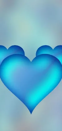 This phone live wallpaper showcases two blue hearts arranged in a stacked position with added detail and shading, giving them a realistic look and feel