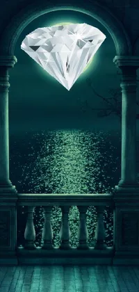 This phone live wallpaper showcases a magnificent diamond resting on a picturesque balcony against a dark night sea backdrop
