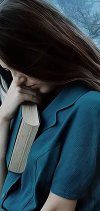This phone live wallpaper features a woman in a blue dress, holding a book close to her chest, creating a photorealistic painting effect