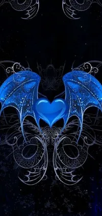 This phone live wallpaper features a blue heart with wings on a dark background