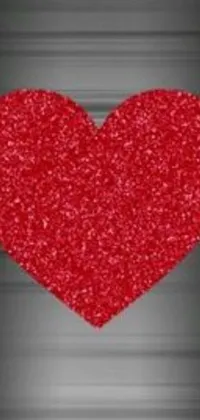 This stunning live wallpaper features a beautifully crafted 3D red heart atop a metallic surface