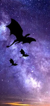 Adorn your mobile screen with this stunning and digital wallpaper, featuring a swarm of bats darting through the vast and starry night sky
