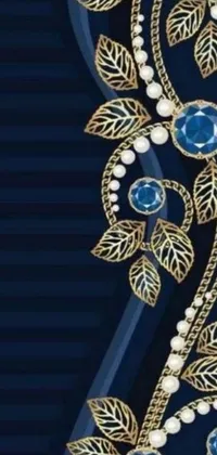 This stunning live wallpaper showcases a beautiful blue and gold brooch adorned with intricate pearls and delicate leaves