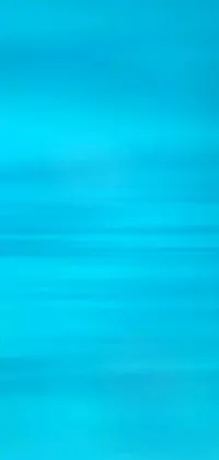 This live wallpaper depicts a surfer riding atop a wave with a gradient background of cyan and blue hues