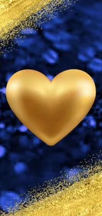 Get captivated by this stunning phone live wallpaper with a dazzling golden heart placed on a rich blue-gold background, featuring an abstract pattern with metallic tones