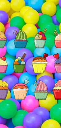 This live wallpaper features a lively ball pit filled with colorful, cartoon-inspired balls emblazoned with adorable cupcakes