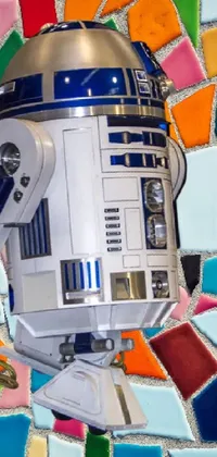 This phone live wallpaper features a stunning close-up of a robot on a mosaic wall inspired by the iconic Star Wars universe