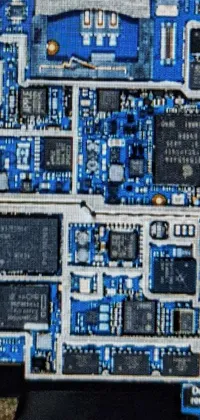 This phone live wallpaper showcases a detailed computer motherboard schematic found in a notebook,captured with a phone camera at 40nm resolution
