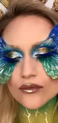 This stunning phone live wallpaper features an enchanting woman with vibrant blue wings that gracefully spread across her face