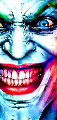 This phone wallpaper depicts the close-up face of a clown with a menacing joker smile
