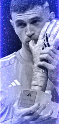 This live wallpaper showcases a black and white portrait of a man holding a trophy in Adidas clothing and hand wraps while facepalming