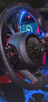 This stunning phone live wallpaper showcases a hyper-realistic render of a mini cooper's carbon fiber steering wheel
