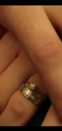This live wallpaper presents an exquisite close-up of a wedding ring showcasing an elegant vintage-inspired design
