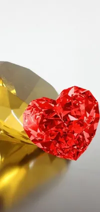 This phone live wallpaper showcases a heart-shaped crystal cubism object adorned with gold and red metal accents, creating a breathtaking ambiance