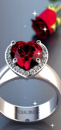 This beautiful phone live wallpaper features a close up of a metallic ring adorned with a red rose and surrounded by sparkling digital red hearts, diamonds, garnet and glitter particles created with advanced octanerender 3d technology