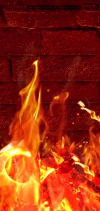 This live wallpaper features an animated fire burning in front of a brick wall, creating a mesmerizing display of warmth and light on your phone