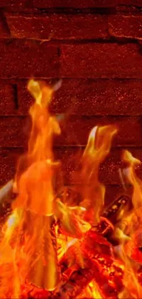 This captivating live wallpaper depicts a blazing fire in front of a textured brick wall